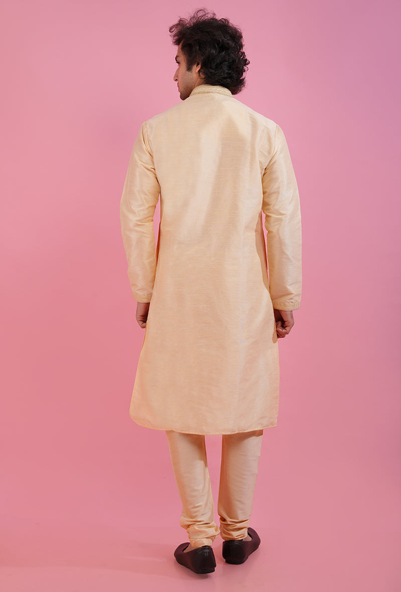 Shine at events in the USA with this elegant light gold kurta pajama, crafted for comfort and sophistication.