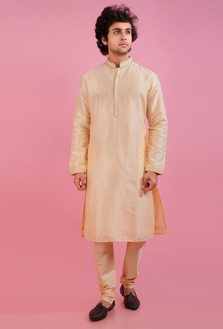 Celebrate in style with this light gold kurta pajama set, featuring luxurious silk blend fabric and embroidery.