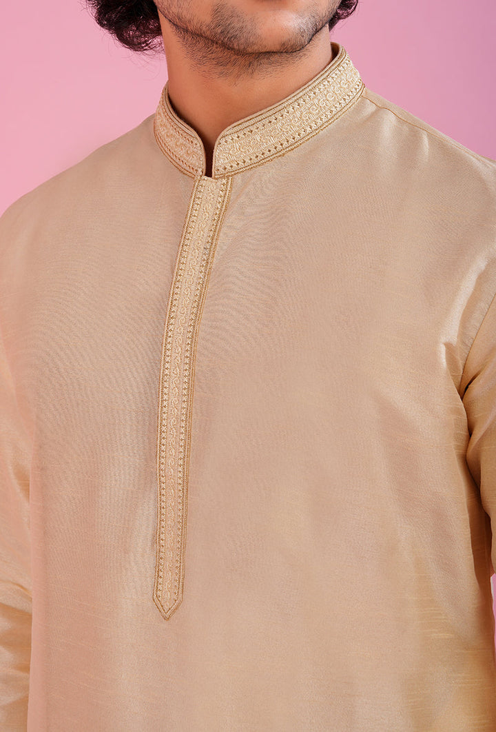 Elevate your festive wardrobe with this stylish light gold kurta pajama set, designed for special occasions.