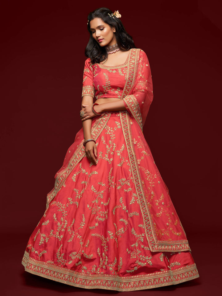 Semi-stitched coral red lehenga with sequin work and dori details.