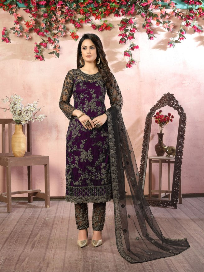 Women's rich purple salwar kameez set with intricate designs for traditional events.