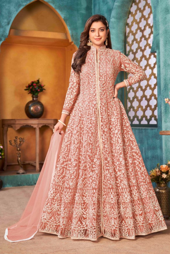 Elegant peach salwar kameez featuring exquisite detailing, perfect for enhancing your wardrobe for special celebrations.