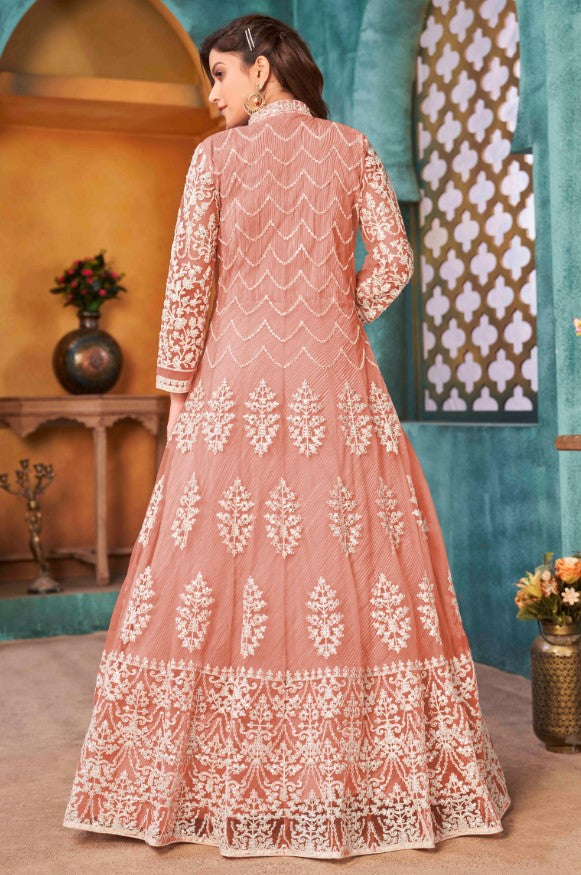 Chic peach salwar kameez showcasing intricate craftsmanship, designed for modern women celebrating special events in the USA.