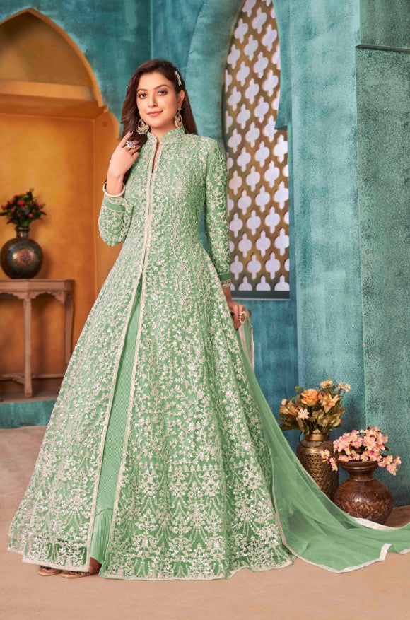 Stylish light green salwar kameez featuring intricate detailing, perfect for enhancing your festive wardrobe.