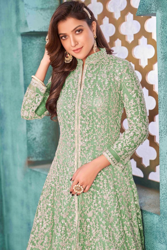 Beautifully crafted light green salwar kameez, ideal for weddings and gatherings with luxurious fabric and elegant style.