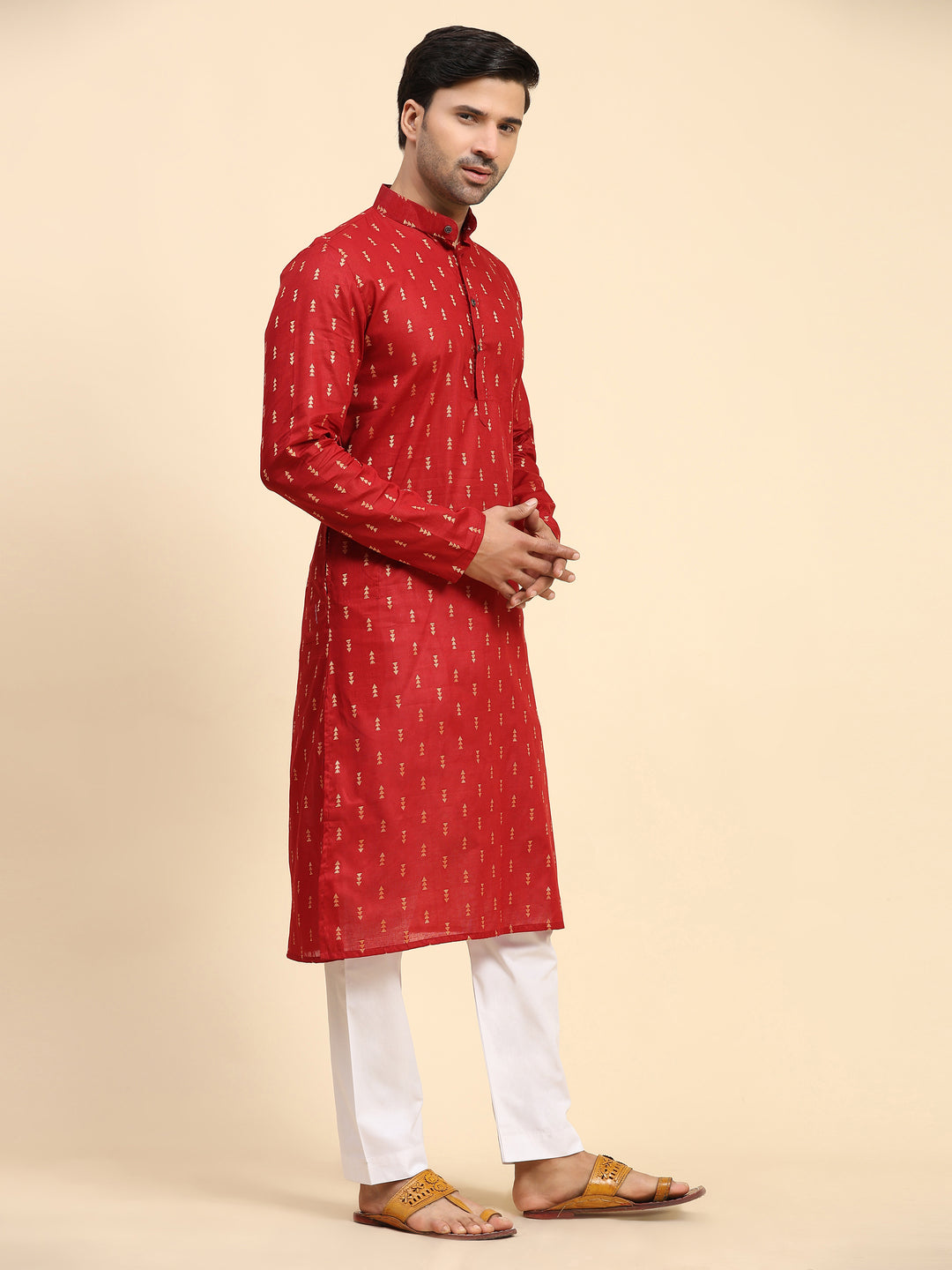 Elegant red men's kurta featuring handwoven motifs for a striking look.