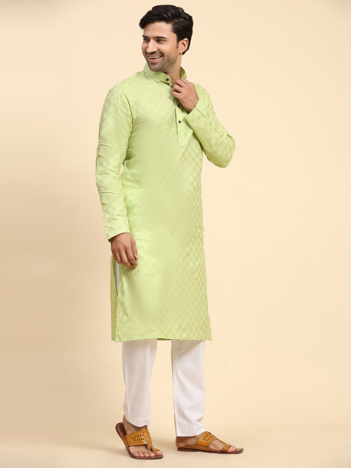 Ethnic men's light green kurta pajama with intricate block work