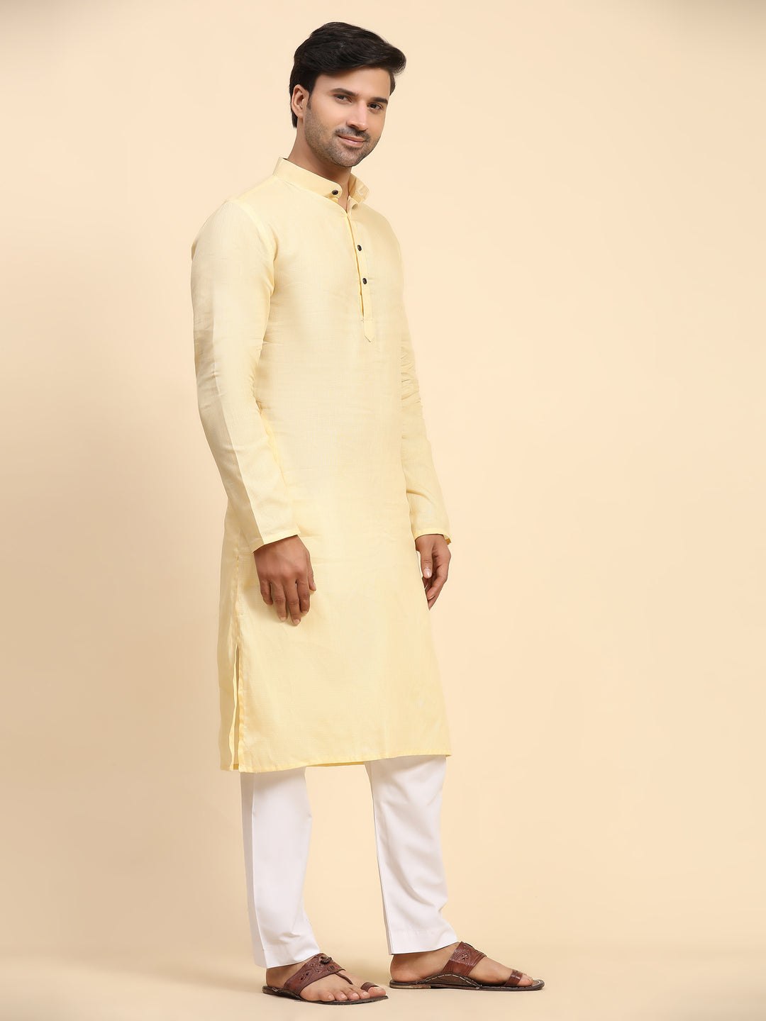 Traditional cream yellow kurta set for men with full weaved motifs, perfect for ethnic celebrations.