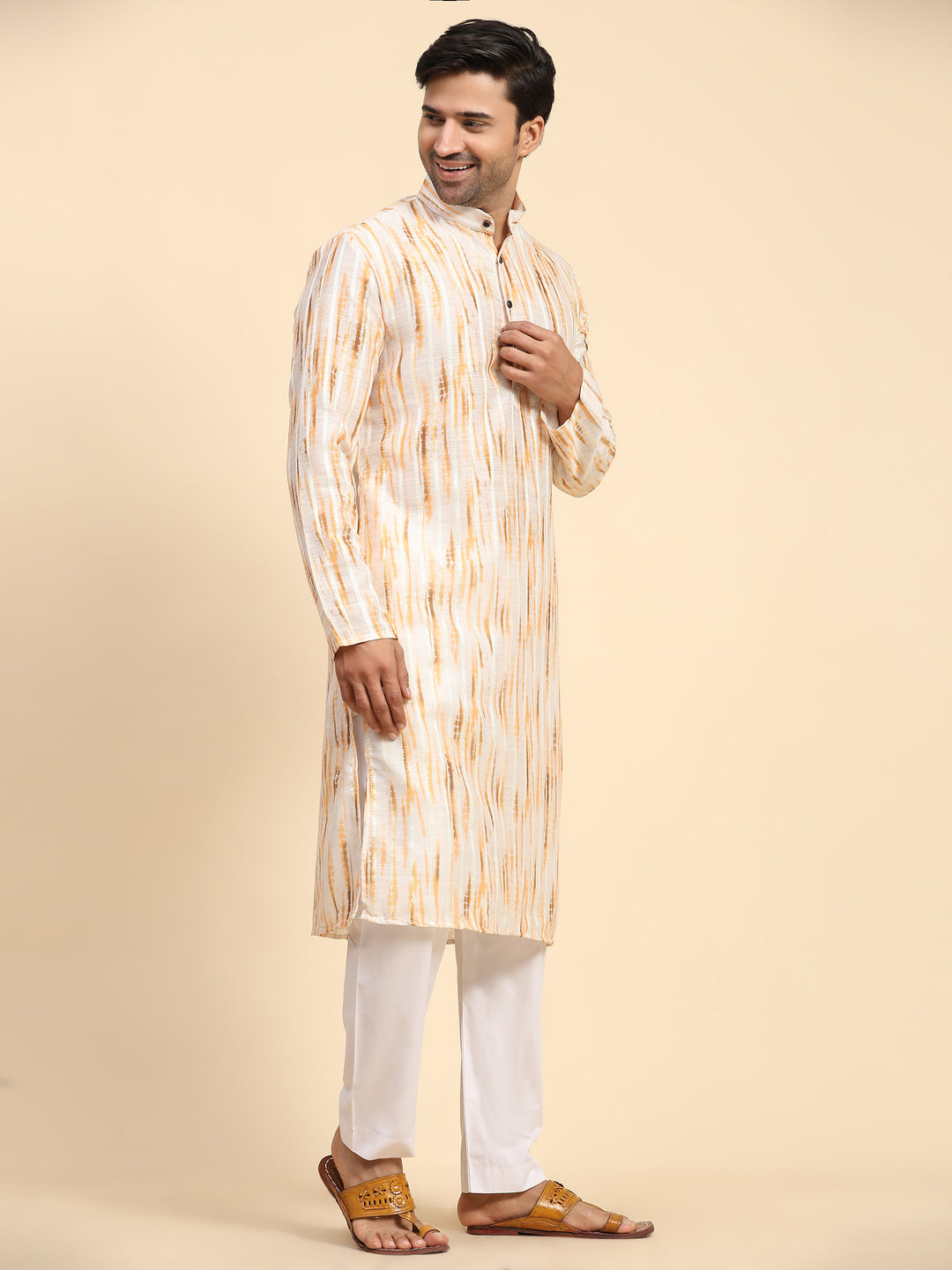 Men’s yellow kurta pajama set with tie-dye print, ideal for festive celebrations.