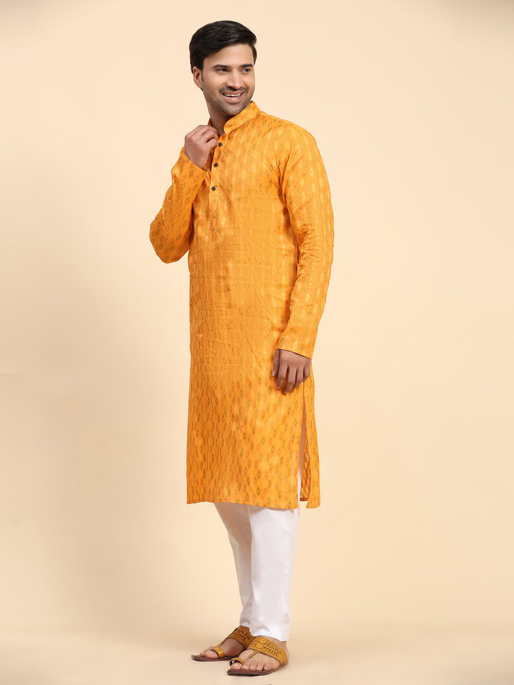 Elegant men's kurta pajama in light orange, perfect for cultural events.