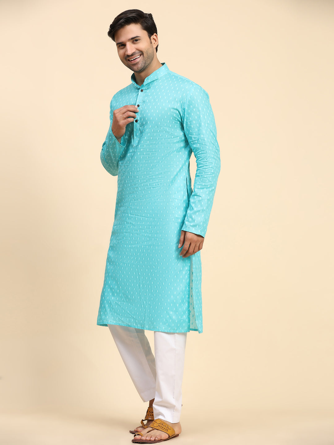 Luxurious cyan blue kurta set with embroidered details for festive celebrations.