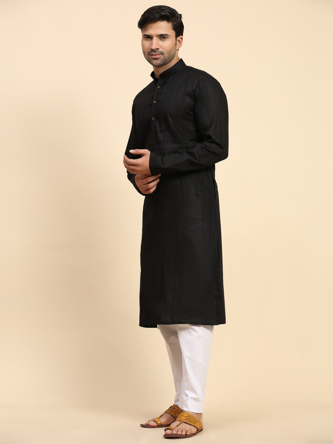 Handcrafted men's black kurta pajama with rich details, perfect for traditional celebrations and weddings in the USA market.