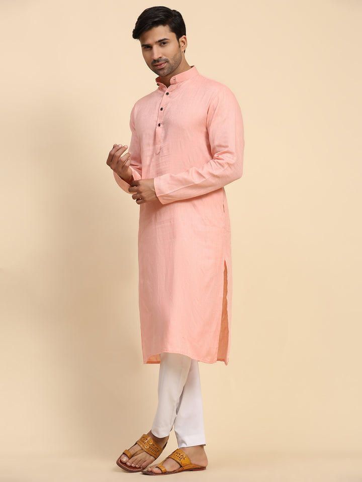 Traditional baby pink kurta pajama for men, crafted from pure cotton for comfort.