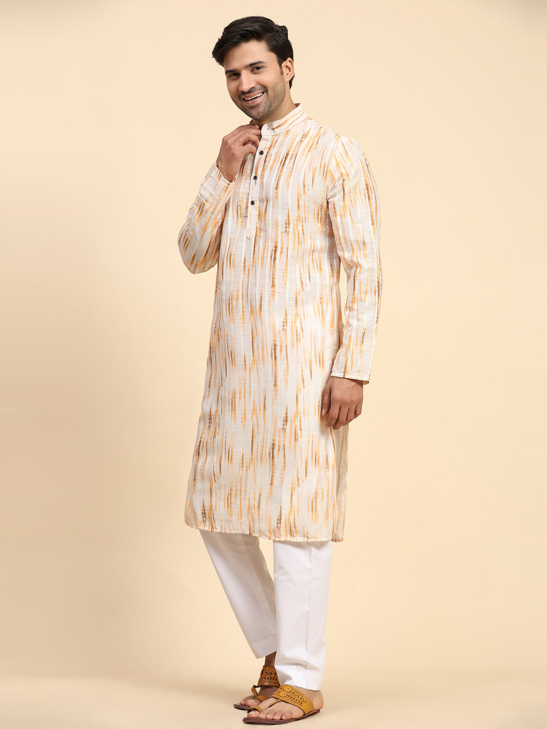 Stylish yellow kurta set for men with tie-dye print, perfect for festive wear.