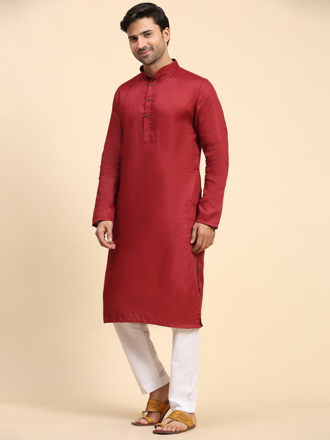 Festive maroon kurta pajama set with intricate designs, perfect for celebrations.