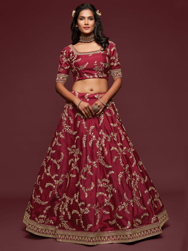 Semi-stitched traditional lehenga with lace and embroidery work.