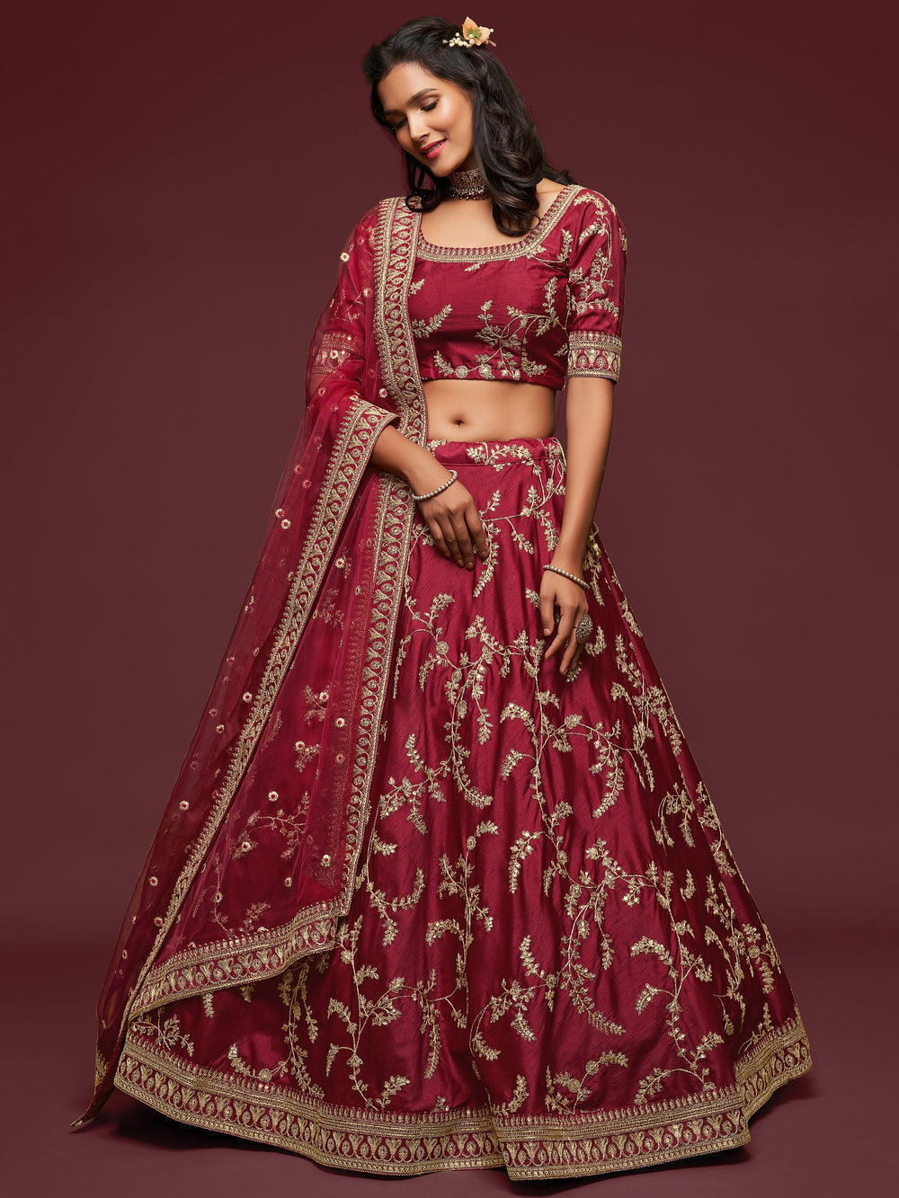 Party wear lehenga for women with matching embroidered choli and dupatta.