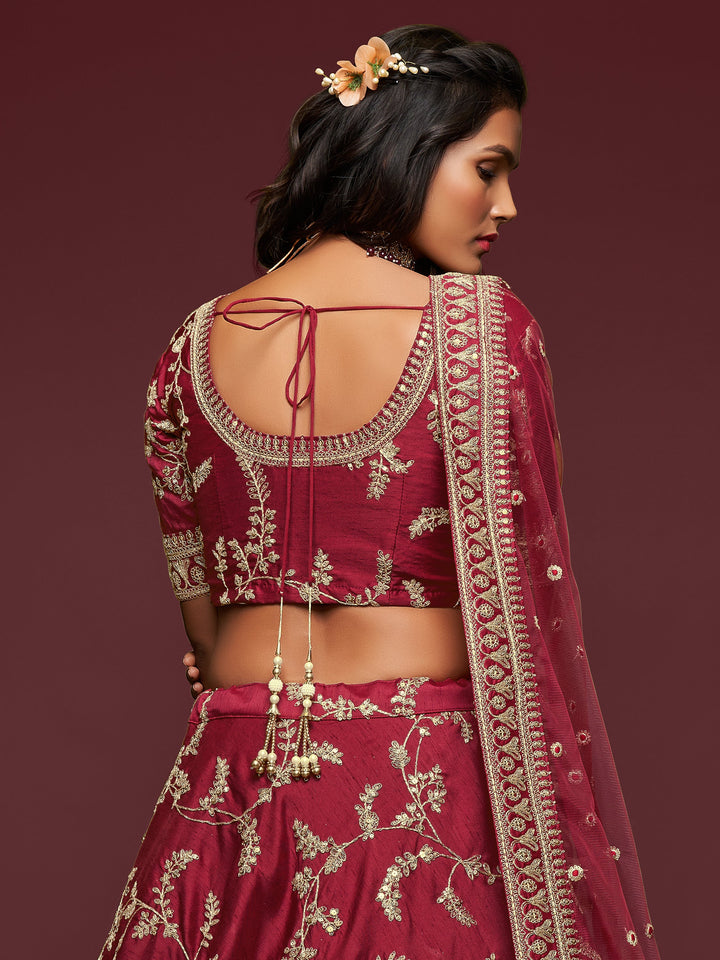 Bridal lehenga with net dupatta and four-side embroidery details.