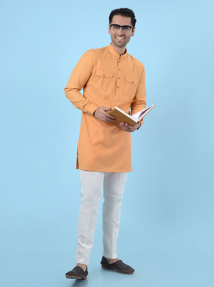 USA men’s elegant orange kurta, ideal for cultural occasions.