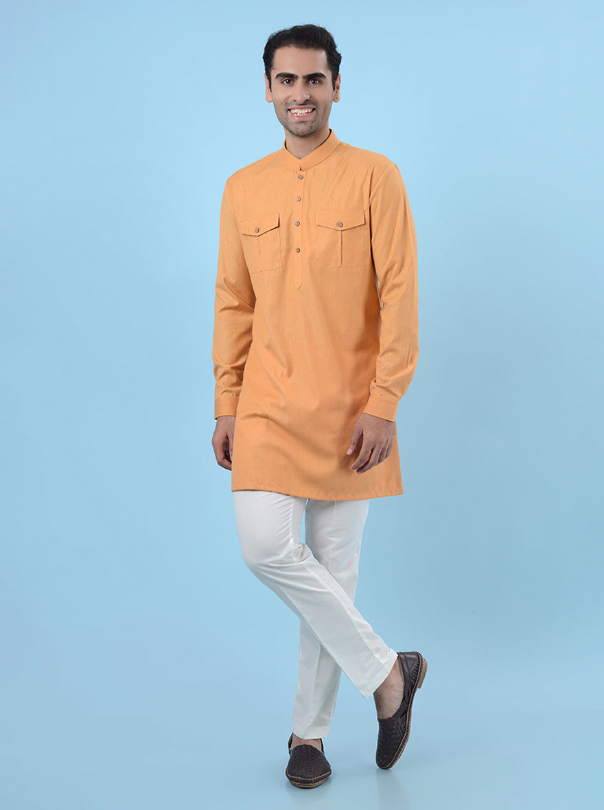 Comfortable orange kurta pajama for men, designed for festive events.