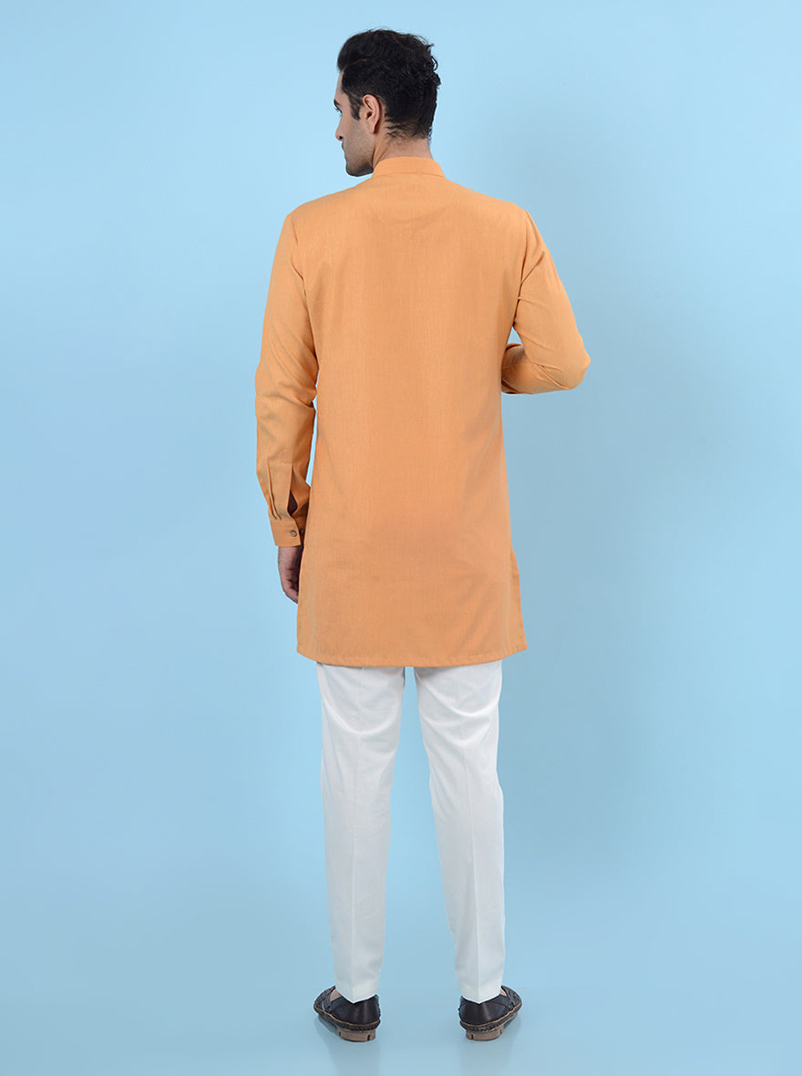 Fashionable orange kurta set, perfect for enhancing your ethnic wardrobe.