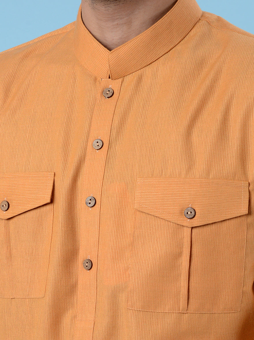 Vibrant orange silk blend kurta pajama for men, ideal for weddings and cultural celebrations.