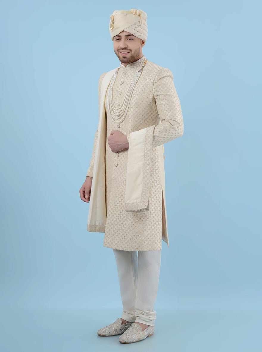 Make a lasting impression on your special day with this Cream & Gold Sherwani, designed for grooms in the USA who seek elegance and a touch of tradition in their wedding attire.