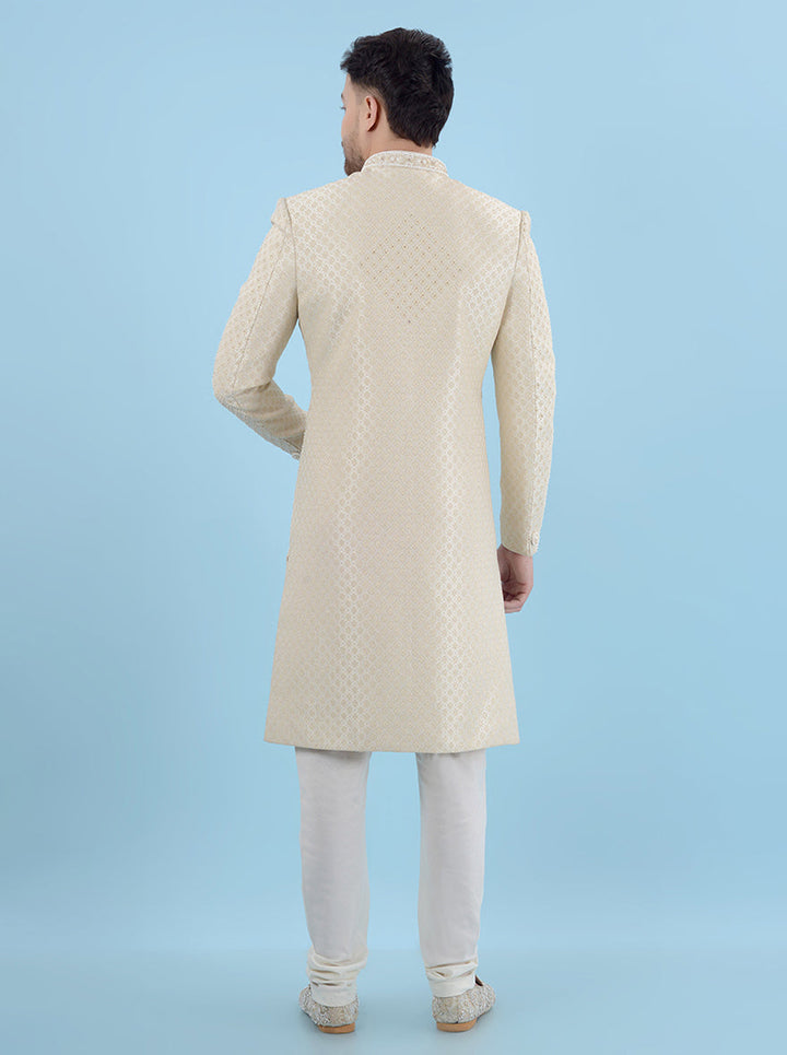 Elevate your wedding look with this Cream & Gold Sherwani, perfect for grooms in the USA, blending stylish sophistication with traditional charm to make you unforgettable.