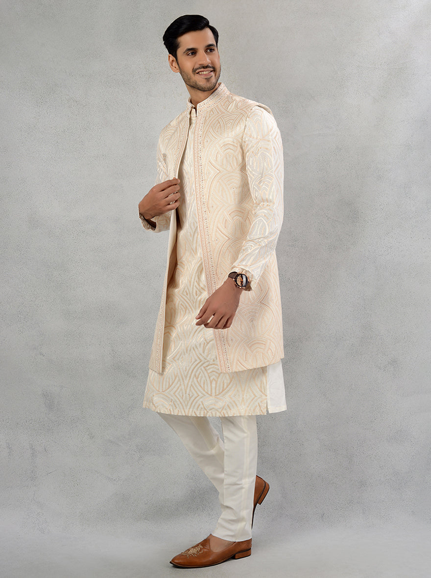 This beautifully crafted cream sherwani features intricate embroidery, making it a perfect choice for grooms looking to blend tradition with contemporary elegance at their wedding in the USA.