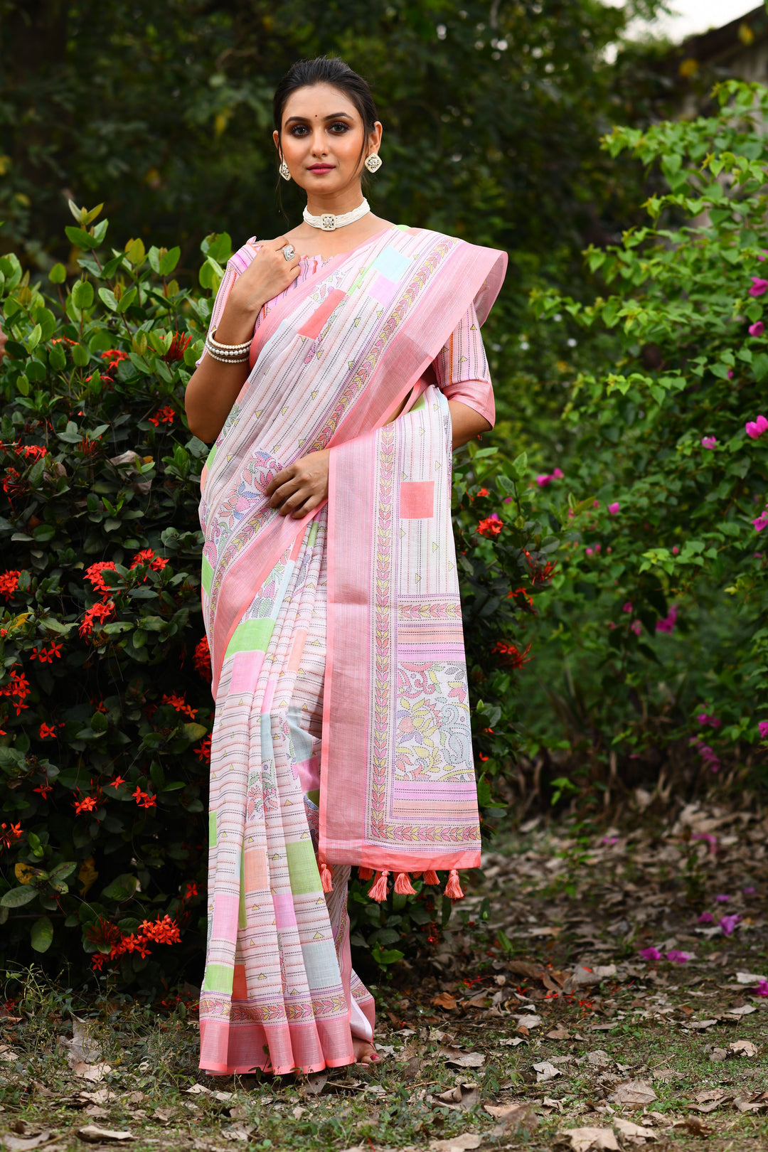 Fresh and lively yellow linen saree with intricate floral pallu and cotton bundas, designed for cultural events.