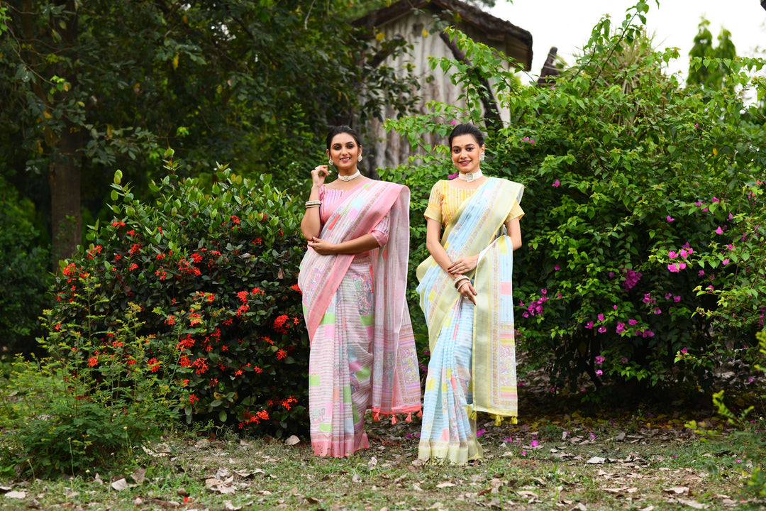 Lovely pink linen saree with a floral pallu and cotton bundas charm, ideal for evening events and weddings.