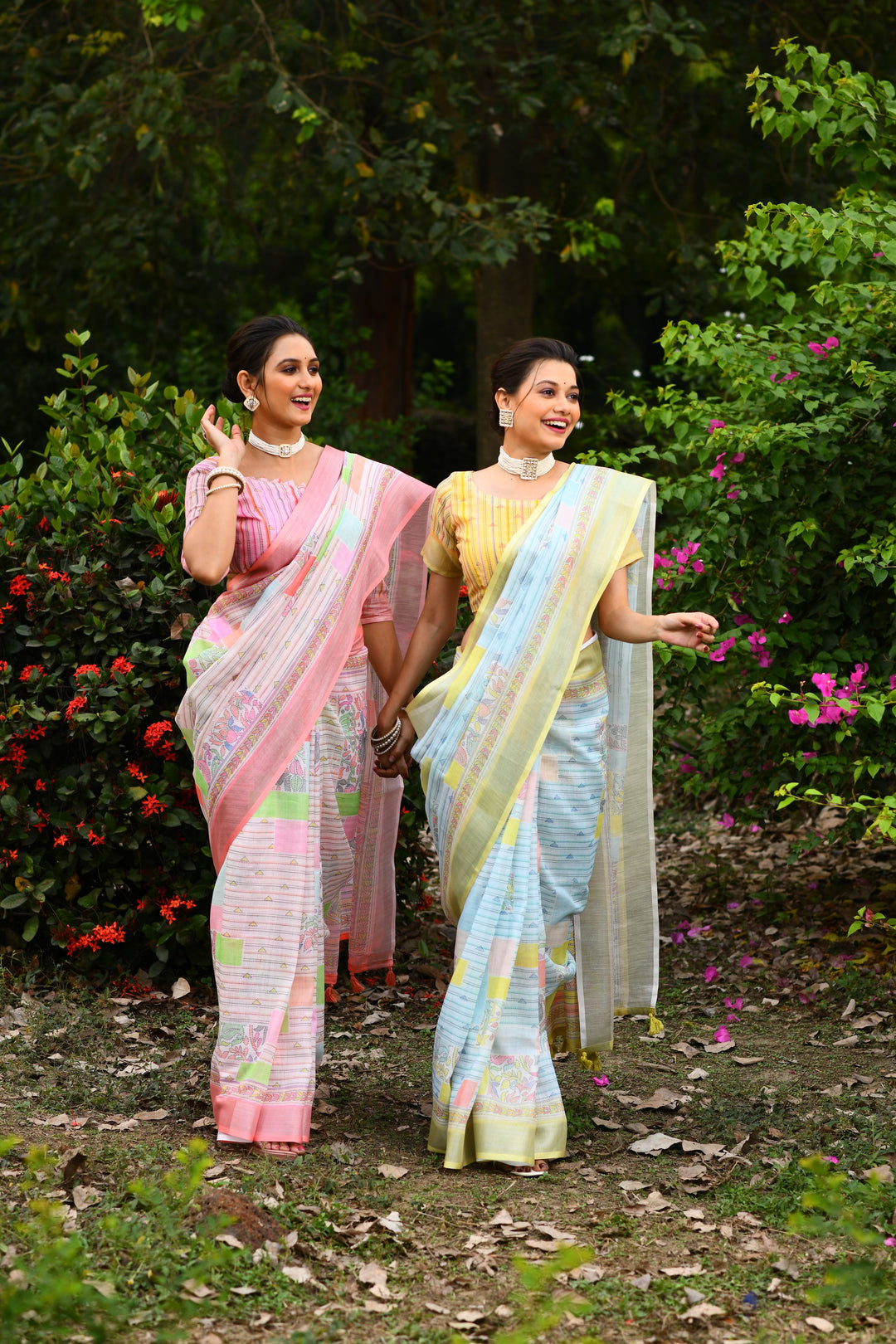 Graceful pink linen saree with a detailed floral pallu, perfect for festive and cultural celebrations.