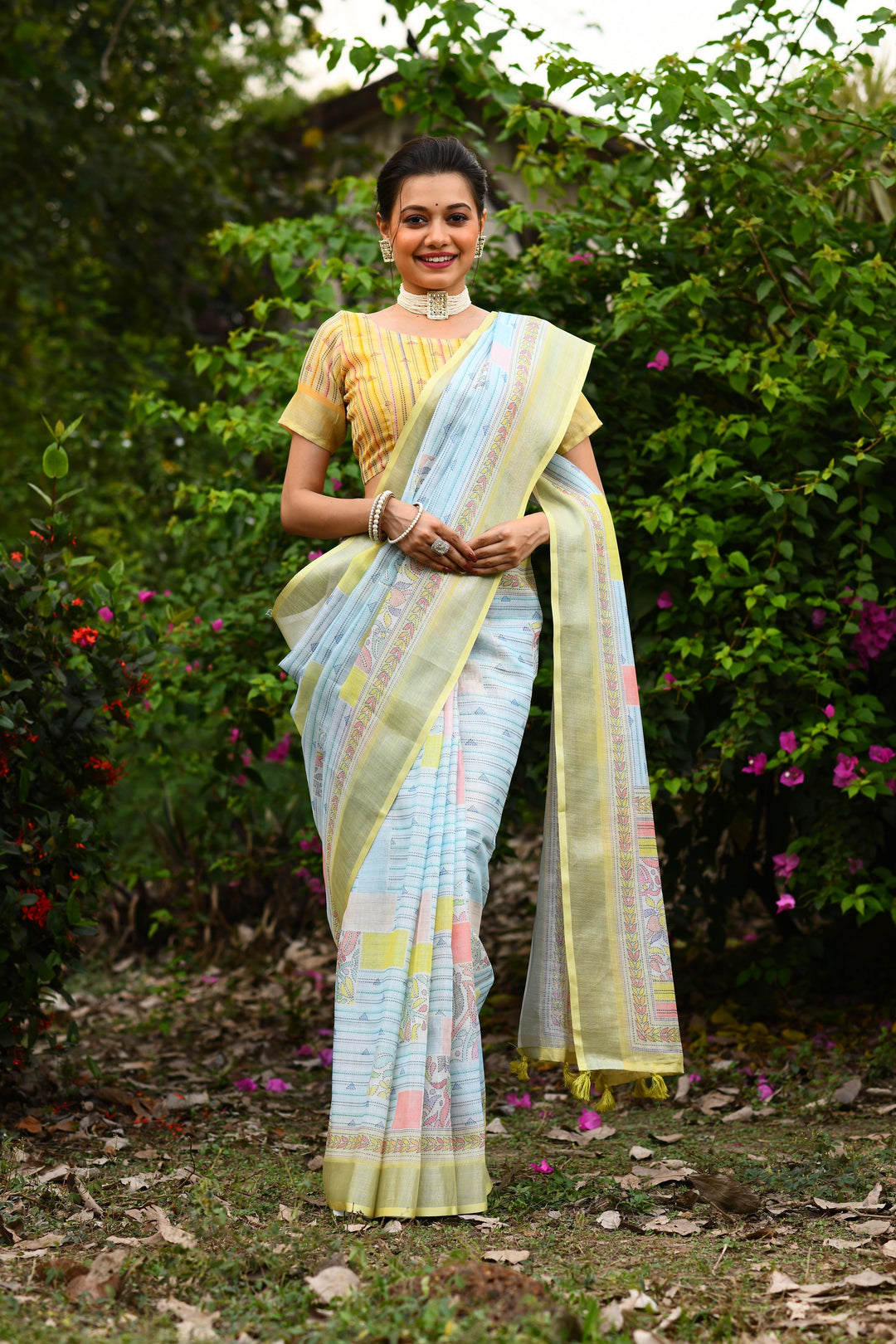 Elegant pink linen saree with a floral pallu, designed for a refreshing and stylish appearance at weddings and gatherings.