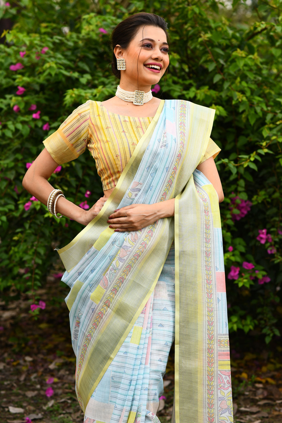 Stunning pink linen saree with a floral pallu and cotton bundas charm, ideal for day and evening events.