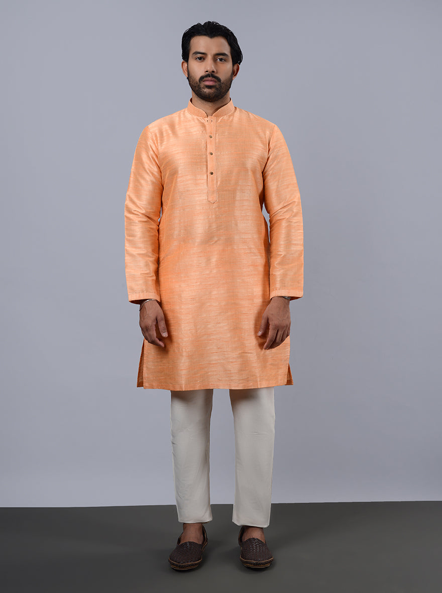 Elegant coral peach kurta for men, suitable for celebrations and gatherings.