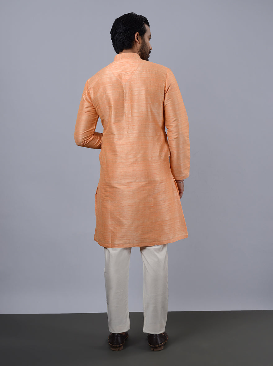 Unique coral peach kurta pajama, showcasing a contemporary design.