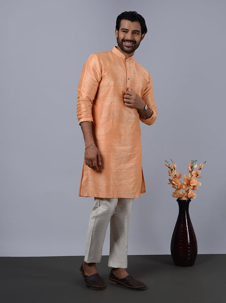 Stylish coral peach kurta pajama, enhancing your wardrobe with elegance.