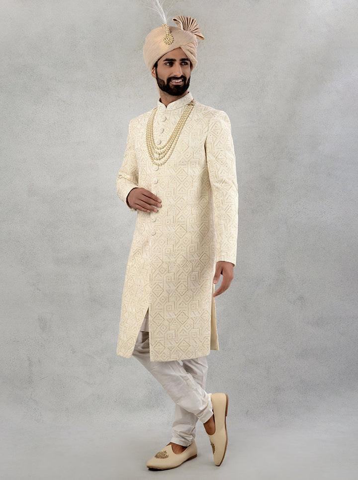 Shop this stunning cream embroidered silk blend sherwani for an unforgettable wedding experience.