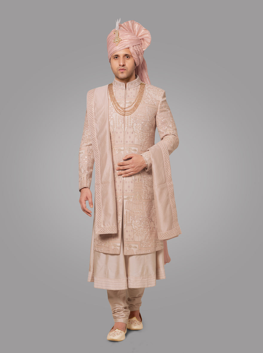 This elegant Onion Pink Sherwani features detailed embroidery, perfect for grooms celebrating in the USA.