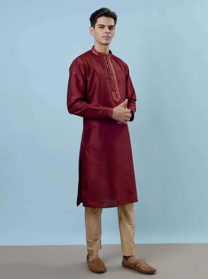 Elegant wine kurta pajama featuring intricate details, perfect for making a statement at events.