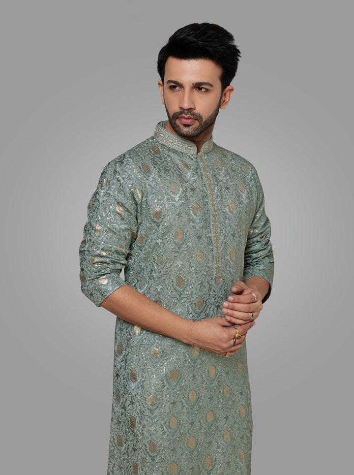 Stylish Mint Green Kurta Pajama Set for men, featuring intricate resham embroidery.