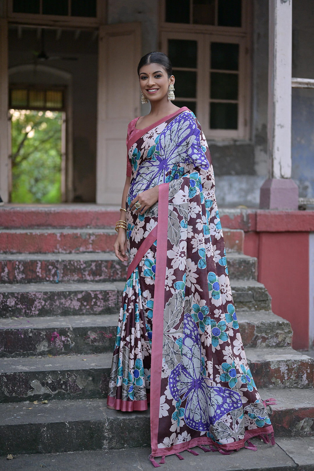 Sandy silk saree with floral design and fancy tassels for festive celebrations