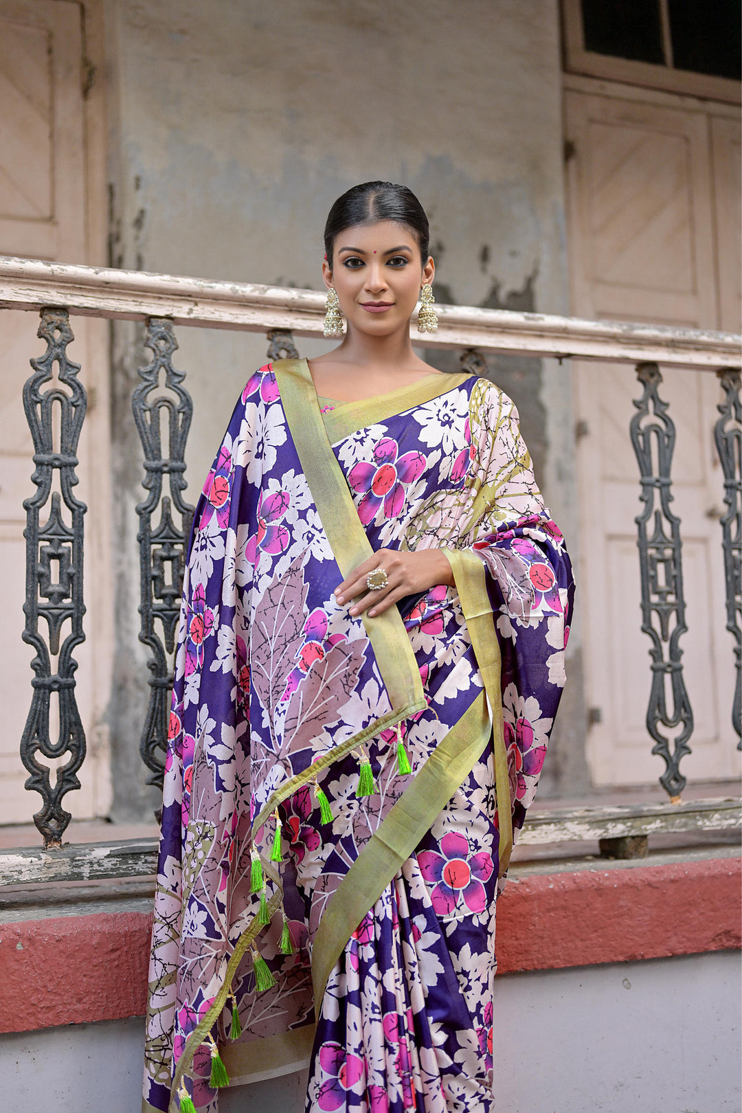 Sandy silk saree with floral design and decorative tassels, ideal for festivals