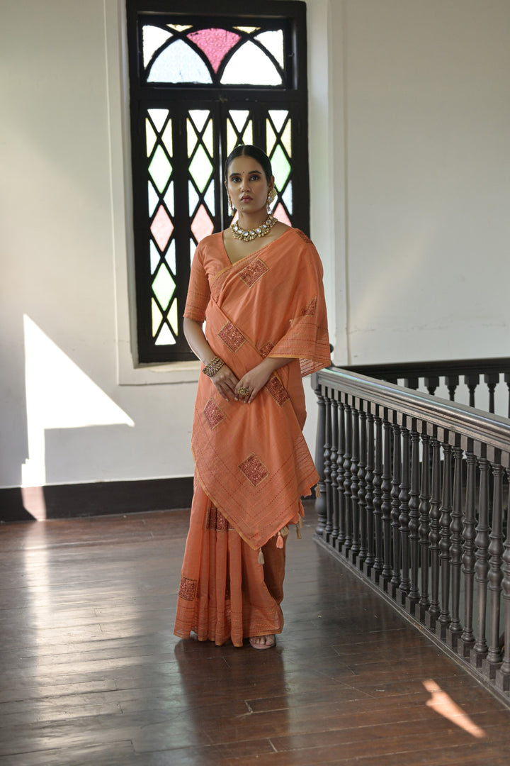 Radiant orange Kantha stitch saree made from handloom Khadi Tussar silk, perfect for making a bold traditional statement.