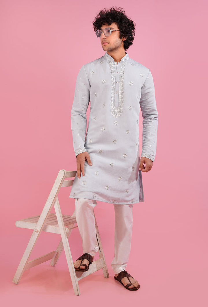 Shine at special occasions with this stunning sky blue kurta pajama, crafted from luxurious silk blend fabric.