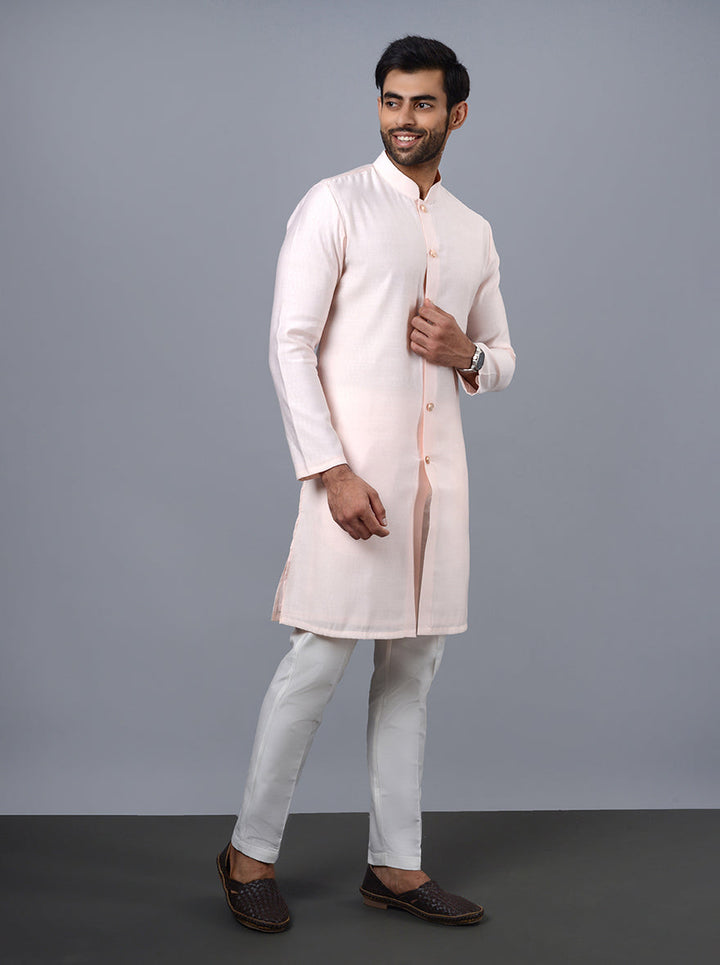 Unique pink kurta pajama, showcasing traditional design elements.