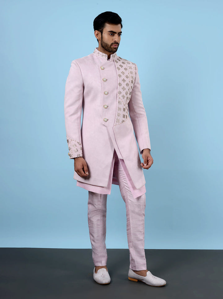 Shine at festive events in the USA with this pink Indowestern, made from luxurious suede and showcasing exquisite embroidery.