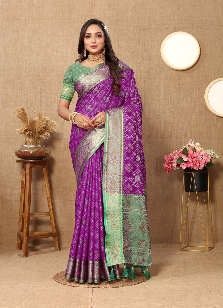 Purple Designer Patola silk sari with luxurious zari and detailed pallu, perfect for weddings and ceremonies.