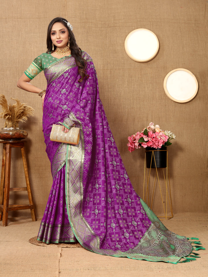 Classic purple Designer Patola silk sari with exquisite pallu and zari work, perfect for grand events.