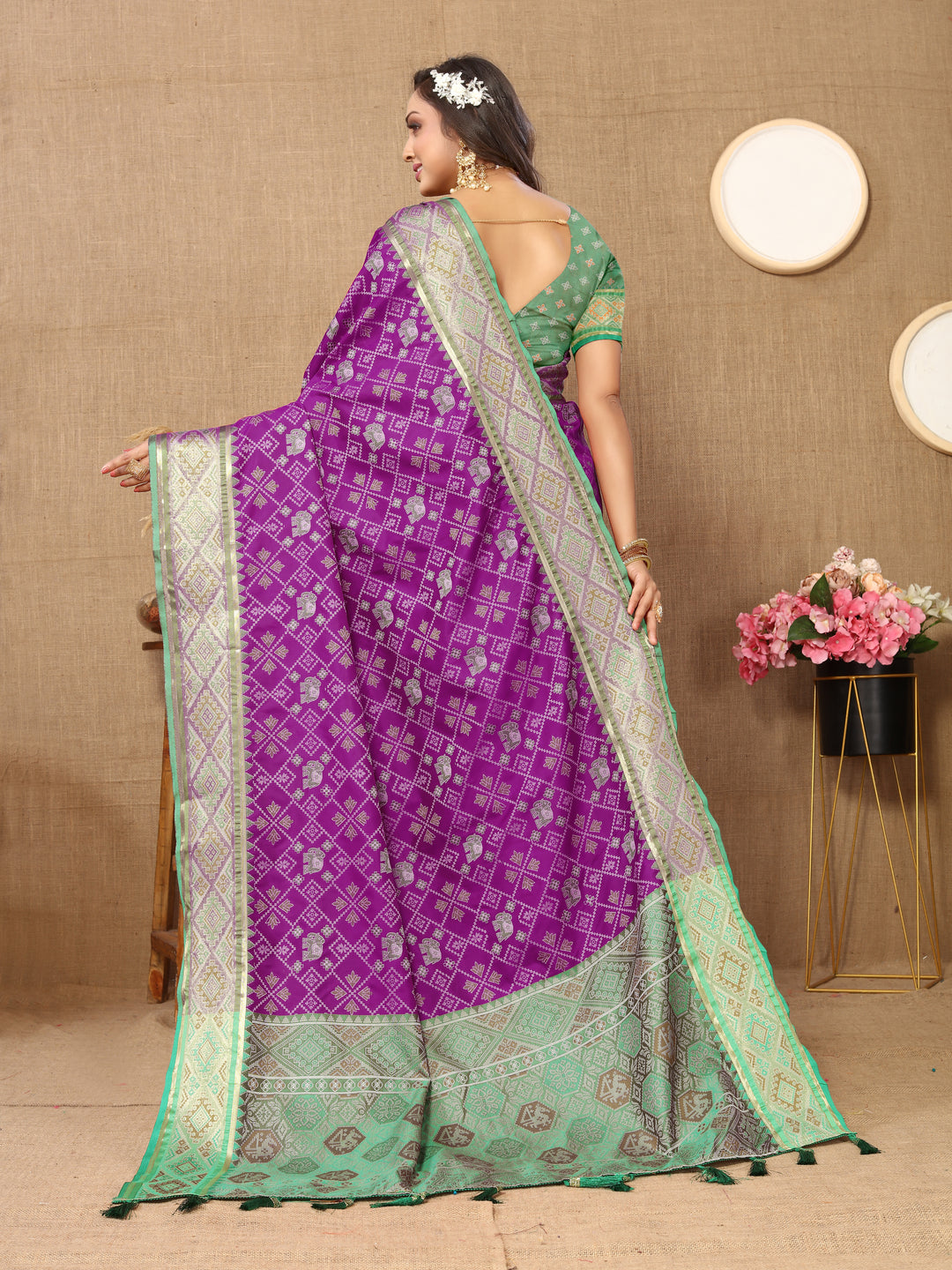 Beautiful purple Designer Patola silk sari with luxurious zari pallu, perfect for festive occasions.